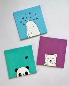 three small square paintings with animals painted on them