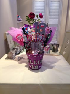 a vase filled with lots of items on top of a table