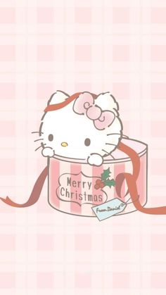 a hello kitty christmas card with a bow on it's head and the caption merry christmas