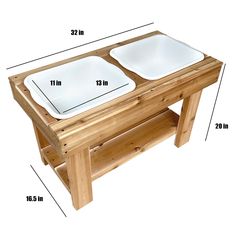 a wooden table with two white plates on it and measurements for each plate in front