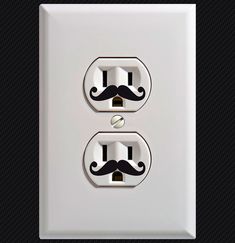 two light switch plates with mustaches on each one and an outlet in the middle