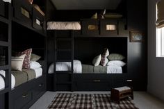 a bedroom with bunk beds and checkered rug