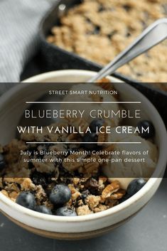 a bowl of blueberry crumble with vanilla ice cream