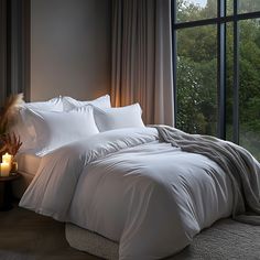 Beautiful bedroom featuring Hampton and Astley silky smooth Egyptian cotton sateen bedding in pure white