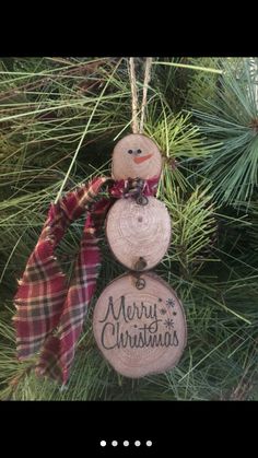 two wooden ornaments hanging from a christmas tree with the words, one of my best friends are