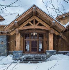 a house that has snow on the ground and steps leading up to it's front door