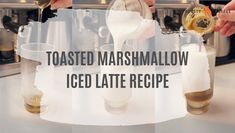 toasted marshmallow iced latte recipe being poured into glasses with the words toasted marshmallow iced latte recipe