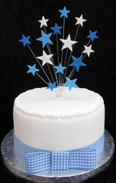 a white cake topped with blue and white stars