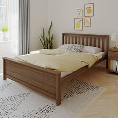 a bedroom with white walls and wooden furniture