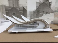 a model of a building on top of a cardboard box