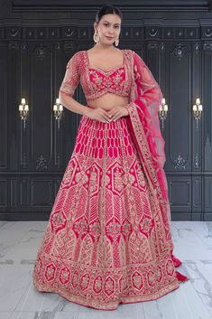 This Bridal Lehenga BL-283 is a stunning choice for your special day. The rich red color is complemented by intricate gold embroidery, adding a touch of elegance and luxury. Made with quality materials, this lehenga is sure to make you feel confident and beautiful as you celebrate your wedding.