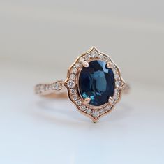 an oval shaped blue sapphire and diamond ring