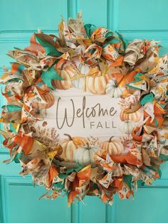 a welcome fall wreath hanging on the front door