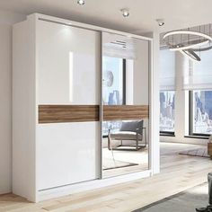 a living room with white walls and wooden floors