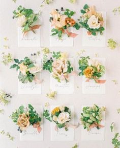 the flowers are arranged on top of each other and placed in small cards with names