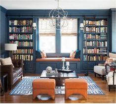 a living room filled with furniture and bookshelves