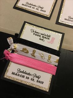 three hair ties are on display in front of some cards that say it's valentine's day