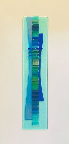 two toothbrushes sitting in a glass holder