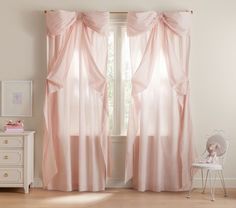 a pink curtain in front of a window