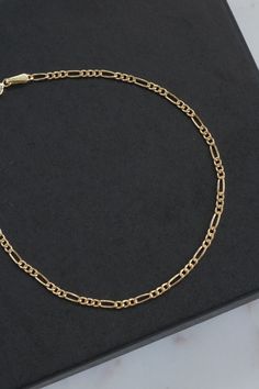 "18k Solid Gold Figaro Chain Bracelet. Length: 6 5/8\" Width: 1mm Weight: 0.74 grams Marked: 750 (18k solid gold) Back to the shop: https://www.etsy.com/shop/SusVintage?ref=hdr_shop_menu If you have any questions feel free to contact me. Thank you!!" Luxury Oval Link Chain Bracelet With Figaro Chain, Luxury Figaro Chain Bracelet With Oval Link, Luxury Figaro Chain Bracelet As Gift, Luxury Gold Bracelet With Figaro Chain, Luxury Bracelet With Figaro Chain And Oval Link, Luxury Gold Bracelet With Figaro Chain As Gift, Luxury Gold Figaro Chain Bracelet As Gift, Luxury Yellow Gold Figaro Chain Bracelet, Figaro Chain Bracelet Jewelry Gift