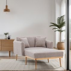 a living room scene with focus on the armrests and footstool,