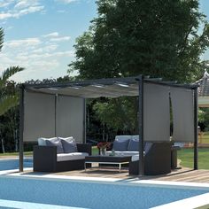 an outdoor living area next to a swimming pool with furniture and privacy screens on it