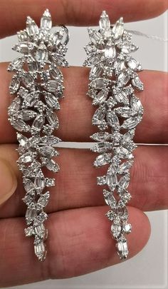 LAST CALL, LAST CHANCE LIQUIDATION SALE The Following Items we are offering is a Rare Important Spectacular and Brilliant 18KT Gold Large Gorgeous Fancy Cascading Diamond Drop Draping Earrings. Earrings consists of Rare Fine Magnificent Fancy Glittering Diamonds. T.C.W. with approx 3.75CTS of Fancy Baguette and Trillion Cut Diamonds These Magnificent Earrings are a Rare Sample Pair and from a Private Manufacturer that sold to Important 5 Star Hotel and Fine Jewelry Stores and come NWT $18,559 and with a Gemological Certificate! A Pair of Exquisite Masterpieces!! We are in the Process of Liquidation and selling at BELOW DEALERS COST in order to stay in business WE PACK, SHIP, AND INSURE WORLDWIDE COME VISIT US AT:   ROYALE GALLERIES INC. 318 EAST 59TH STREET NEW YORK, NY 10022 212-308-0200 Mint Green Earrings, Rare Jewelry, Heavy Earrings, Liquidation Sale, 5 Star Hotel, Greek Jewelry, Link Earrings, Party Earrings, Star Hotel