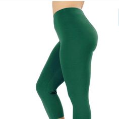 Kelly Green Color 3/4 Length Nylon Legging. Green Stretch Leggings For Pilates, Basic Green Stretch Activewear, Spring Green Stretch Activewear, Green Stretch Activewear For Spring, Stretch Green Activewear For Spring, Capri Length Leggings For Yoga, Capri Length Yoga Leggings, Stretch Mid-thigh Leggings For Pilates, Casual Green Tights For Pilates