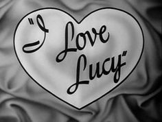 a white heart with the words i love lucy written in black on it's side