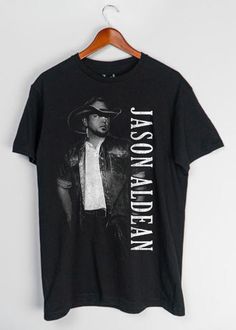 Jason Aldean Vert Portrait T-shirt Black Graphic T-shirt For Country Concerts, Black Short Sleeve Tops For Country Concerts, Black T-shirt With Letter Print For Country Concerts, Graphic Tee For Country Concerts, Pre-shrunk Graphic Tee For Country Concerts, Jason Aldean Concert, Jack Of All Trades, Jason Aldean, Tshirt Ideas