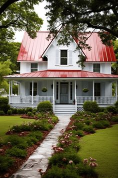 a white house with a red metal roof