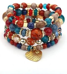 Our Fashionista Bead Bracelets evoke a spirit of elegance, sophistication, and luxury. Crafted with vibrant wood beads (acrylic), these chic bracelets are the perfect addition to any look.These bracelets make a perfect, eye-catching addition to any outfit. Choose your color or get all 3! They make great gifts as they are one-size-fits-all. Free shipping, 12-20 days delivery. Vintage Beaded Bracelet, Hand Accessories, Bohemian Aesthetic, Golden Heart, Christmas Bracelet, Bohemian Bracelets, Crystal Beads Bracelet, Layered Bracelets, Hand Jewelry