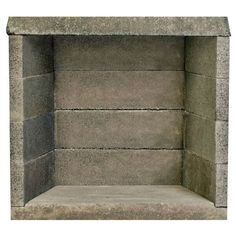 the corner of a stone fireplace with no fire place on it's side, in front of a white background