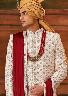 Men Ivory Wedding Groom Sherwani
Designer custom made Ivory embroidered sherwani with chudidar . The latest heavy silk embroidered sherwani is best choice for reception wear . It is suited for Indian and Pakistani wedding wear . 
One of the standout features of this sherwani is the intricate embroidery adorning its surface. Our skilled artisans have meticulously handcrafted every detail, using fine threads and intricate patterns that showcase traditional Indian craftsmanship at its best. The embroidery showcases a harmonious blend of motifs, ranging from floral designs to intricate geometric patterns, creating a visually stunning ensemble that captures attention and admiration . Please note there can be slightly difference between the image and the product due to screen resolution and ca Wedding Groom Sherwani