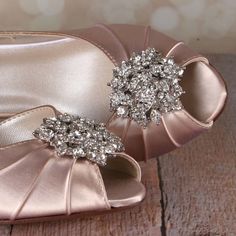 "Dress up your walk down the aisle with these lovely d'orsay peep toe custom wedding shoes. This custom wedding shoe is shown in blush and has a 1 3/4\" heel (measured as shown here: http://www.customweddingshoe.com/about-ellie-wren/heel-height-measurement/). These bridal peeptoes feature our classic rhinestone cluster on the toe. Custom Options: Like it, but don't love it? We do design shoes to your specifications!! To view our options and learn more, please visit our website at: http://www.cus Elegant Open Toe Heels For Bridesmaids, Glamorous High Heel Bridesmaid Wedding Shoes, Elegant Open Toe Bridal Party Accessories, Elegant Open Toe Wedding Shoes For Guests, Elegant Open Toe Shoes For Wedding Guests, Elegant Closed Toe Bridal Accessories For Bridesmaid, Glamorous Low Heel Wedding Heels, Silver Heels For Bridesmaids, Gold Open Toe Wedding Shoes For Guests