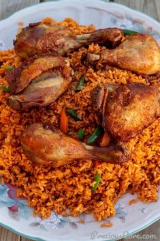 a plate full of rice with chicken and vegetables on it, ready to be eaten