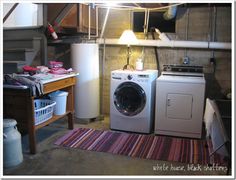 a washer and dryer sitting in a room next to each other on a rug