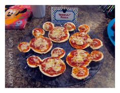 mini pizzas with cheese and pepperoni on a plate