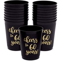 black and gold cheers to 50 years cups with gold foil lettering on the side, set of 12