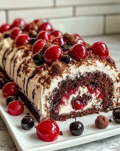 a large piece of cake with cherries on it