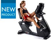 a woman sitting on an exercise bike with the new product logo in front of her