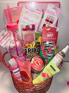 a pink basket filled with lots of different items