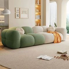 a green and white couch sitting on top of a rug