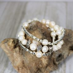 Classic and timeless, made with gorgeous real Freshwater Pearls and Tibetan Silver Patterned beads, this bracelet is the perfect choice for weddings, diner out to that nice restaurant, or anytime you want to feel special. The bracelet is elastic allowing for easy on and off and a fabulously comfortable fit. Designed to layer together each piece works together beautifully for a modern look with a classic style. Makes a great layering piece for that stacked bracelet look. Pearl is also one of June Silver Stretch Bracelet For Wedding, White Bangle Stretch Bracelet For Wedding, Wedding Pearl Rosary Bracelet With Round Beads, Adjustable Pearl White Bracelets For Anniversary, Adjustable Pearl White Bracelet For Anniversary, Pearl Bracelets With Silver Beads For Gifts, Pearl Bracelets With Silver Beads As A Gift, Gift Pearl Bracelets With Silver Beads, Elegant Stretch Bangle Bracelet For Wedding