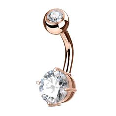 a rose gold belly ring with a cubic stone in the center and two round stones on each side