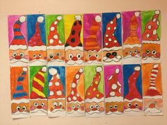 a group of colorful paper cut outs with santa hats and noses on them, all lined up in rows