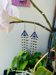 This wire wrapped earrings are made with Labradorite, Kyanite and Quartz gemstones. Each earring is accented with delicate Miyuki beads for a touch of intricate detail. Crafted with high-quality sterling silver wire, these statement earrings are perfect for adding a pop of color and sophistication to any outfit.  Materials: 3mm Faceted Labradorite Beads 3mm Faceted Black Quartz Beads 3mm Faceted Kyanite Beads 11/0 Miyuki Glass Beads Hypoallergenic Surgical Stainless Steel French Hook Wire  Sterling Silver Wire Length: 3.5 inches Original Pattern by Loopé Designs Co. PACKAGING: All pieces come packaged in a jewelry box ready for gift giving. SHIPPING: Free Domestic shipping with orders of $35 and over. Visit our Shop: https://loopedesignscoshop.etsy.com FOLLOW US: INSTAGRAN: @loopedesignsco Artisan Handmade Wrap Drop Earrings, Bohemian Silver Plated Drop Earrings, Bohemian Silver-plated Drop Earrings, Handmade Artisan Dangle Wrap Earrings, Bohemian Silver Plated Wire Earrings For Jewelry Making, Handwoven Chandelier Dangle Earrings As Gift, Unique Wire Wrapped Beaded Earrings With Round Beads, Artisan Wire Wrapped Beaded Earrings, Bohemian Sterling Silver Beaded Earrings Wire Wrapped