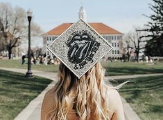 a woman wearing a graduation cap with the number seventy on it