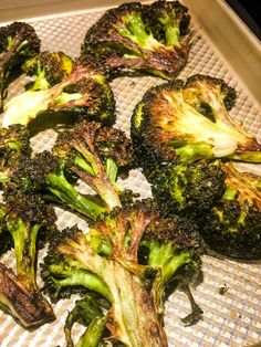 broccoli florets on a baking sheet ready to be cooked