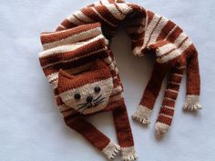 an orange and white knitted cat hat